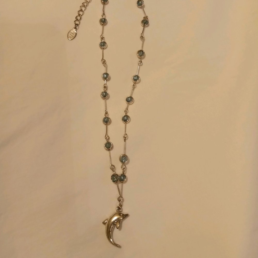 Cool Jewels - Dolphin charm necklace with light blue stones.